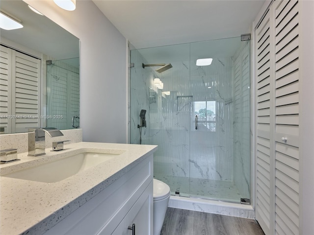 5380 Cedar Lake Dr Unit 204, Boynton Beach, FL 33437 - bathroom featuring a closet, a marble finish shower, vanity, and wood finished floors