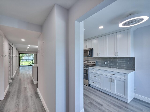 5380 Cedar Lake Dr Unit 204, Boynton Beach, FL 33437 - hall with light wood-style floors, baseboards, and recessed lighting