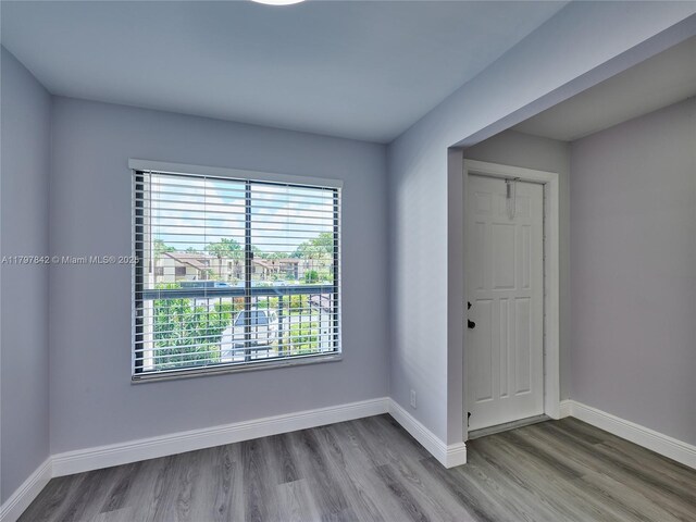 5380 Cedar Lake Dr Unit 204, Boynton Beach, FL 33437 - spare room featuring wood finished floors and baseboards