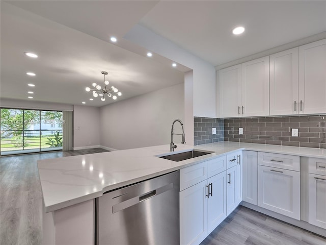 5380 Cedar Lake Dr Unit 204, Boynton Beach, FL 33437 - kitchen featuring stainless steel dishwasher, a sink, light wood-style floors, white cabinets, and recessed lighting