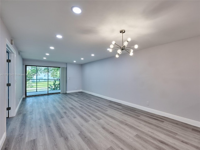 5380 Cedar Lake Dr Unit 204, Boynton Beach, FL 33437 - unfurnished room with recessed lighting, baseboards, wood finished floors, and a chandelier