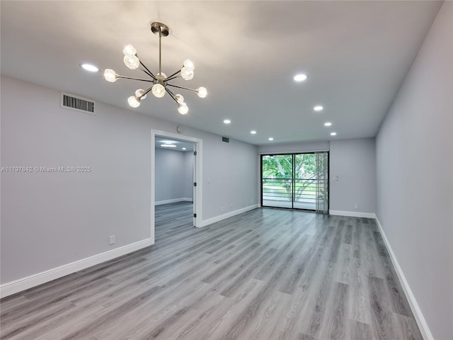 5380 Cedar Lake Dr Unit 204, Boynton Beach, FL 33437 - unfurnished room with light wood-style flooring, baseboards, recessed lighting, and a chandelier
