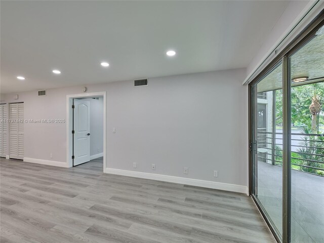 5380 Cedar Lake Dr Unit 204, Boynton Beach, FL 33437 - unfurnished room with baseboards, recessed lighting, and light wood-style flooring