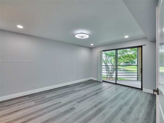 5380 Cedar Lake Dr Unit 204, Boynton Beach, FL 33437 - spare room with wood finished floors, baseboards, and recessed lighting