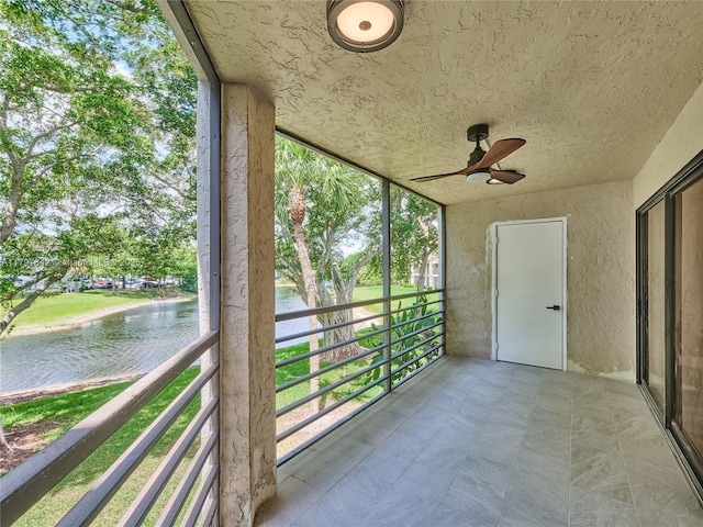 5380 Cedar Lake Dr Unit 204, Boynton Beach, FL 33437 - unfurnished sunroom with a water view and ceiling fan