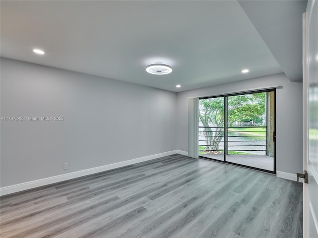 5380 Cedar Lake Dr Unit 204, Boynton Beach, FL 33437 - spare room with wood finished floors, baseboards, and recessed lighting
