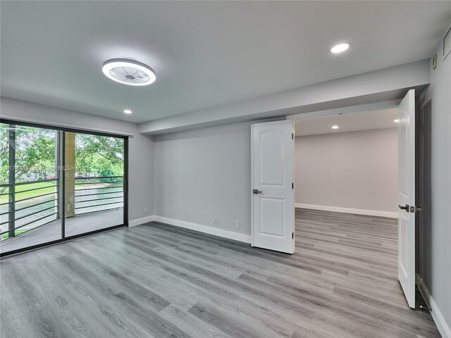 5380 Cedar Lake Dr Unit 204, Boynton Beach, FL 33437 - spare room with wood finished floors, recessed lighting, and baseboards