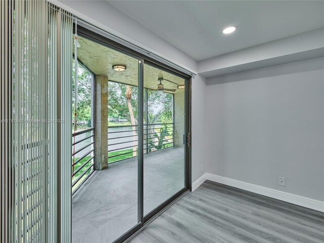5380 Cedar Lake Dr Unit 204, Boynton Beach, FL 33437 - spare room featuring baseboards, wood finished floors, and recessed lighting