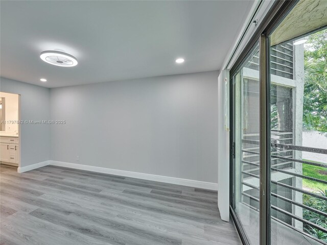 5380 Cedar Lake Dr Unit 204, Boynton Beach, FL 33437 - spare room with light wood-type flooring, baseboards, and recessed lighting