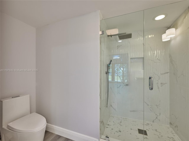 5380 Cedar Lake Dr Unit 204, Boynton Beach, FL 33437 - full bathroom with a marble finish shower, toilet, baseboards, and wood finished floors
