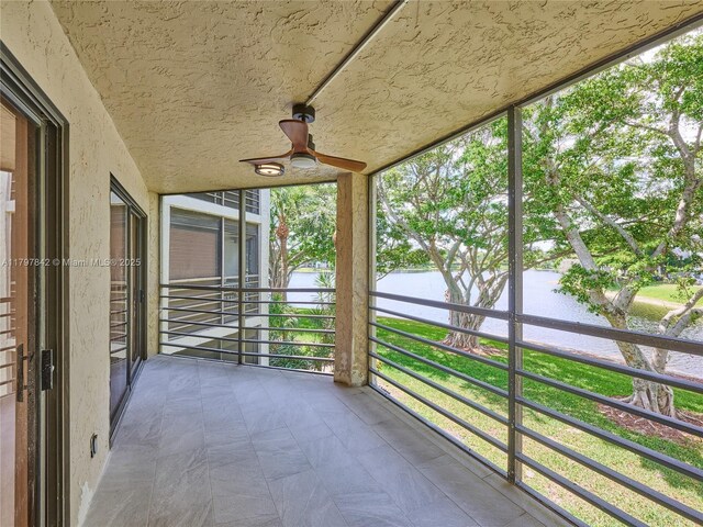 5380 Cedar Lake Dr Unit 204, Boynton Beach, FL 33437 - unfurnished sunroom with a water view and a ceiling fan
