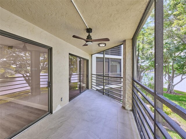 5380 Cedar Lake Dr Unit 204, Boynton Beach, FL 33437 - unfurnished sunroom with ceiling fan, plenty of natural light, and lofted ceiling