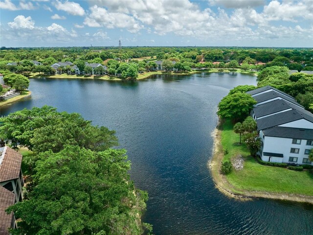 5380 Cedar Lake Dr Unit 204, Boynton Beach, FL 33437 - drone / aerial view of a nearby body of water and a tree filled landscape