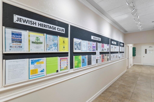 5380 Cedar Lake Dr Unit 204, Boynton Beach, FL 33437 - corridor featuring track lighting, tile patterned floors, ornamental molding, and baseboards