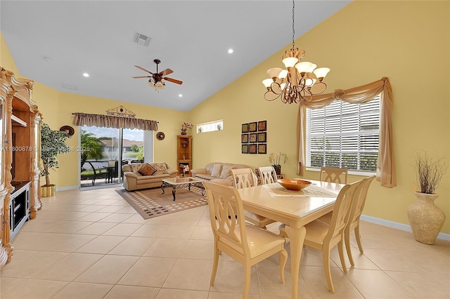 23157 Addison Lakes Cir, Boca Raton, FL 33433 - dining area with light tile patterned floors, high vaulted ceiling, a chandelier, a ceiling fan, and baseboards