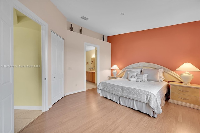 23157 Addison Lakes Cir, Boca Raton, FL 33433 - bedroom with light wood-type flooring and ensuite bathroom