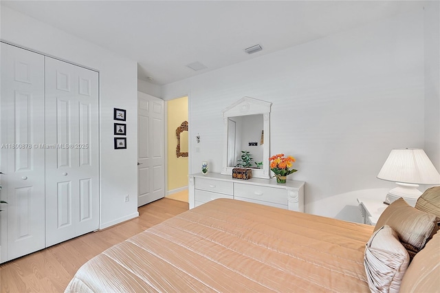 23157 Addison Lakes Cir, Boca Raton, FL 33433 - bedroom with light wood-type flooring and a closet