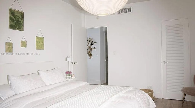 bedroom featuring wood finished floors