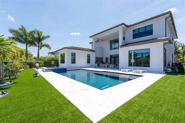 9625 Vescovato Way, Boca Raton, FL 33496 - rear view of property with stucco siding, a patio, a lawn, and a pool with connected hot tub