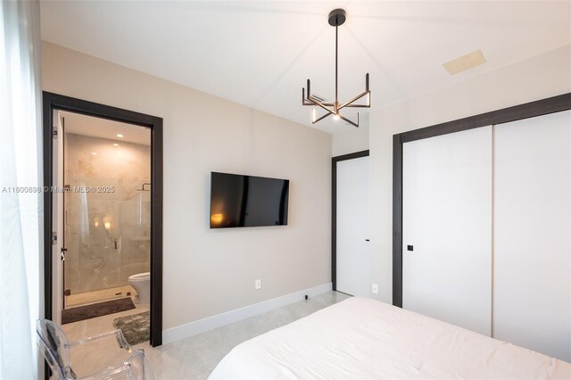 9625 Vescovato Way, Boca Raton, FL 33496 - bedroom with a chandelier, a closet, baseboards, and connected bathroom