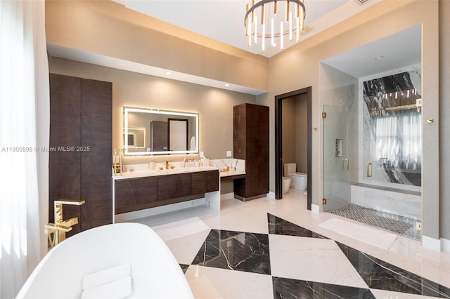 9625 Vescovato Way, Boca Raton, FL 33496 - full bathroom featuring a stall shower, a freestanding bath, toilet, vanity, and marble tiled flooring