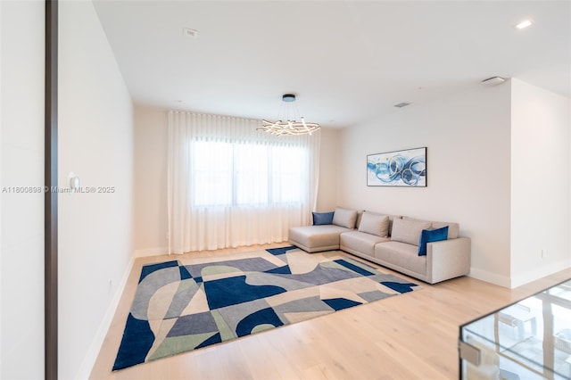 9625 Vescovato Way, Boca Raton, FL 33496 - living area with a chandelier, wood finished floors, and baseboards
