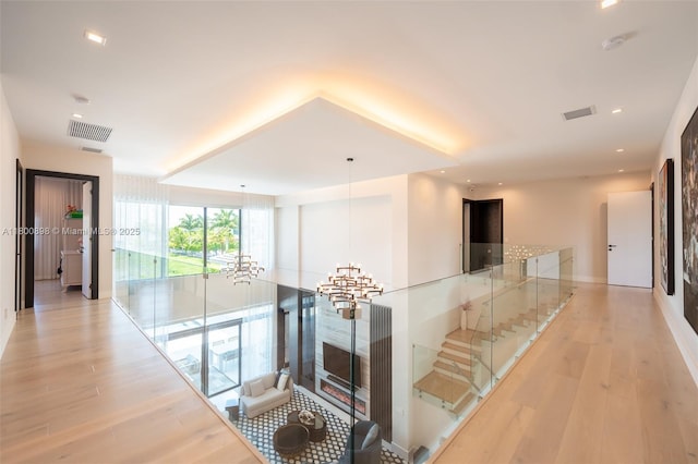 9625 Vescovato Way, Boca Raton, FL 33496 - hall featuring expansive windows, light wood-style floors, recessed lighting, and a chandelier