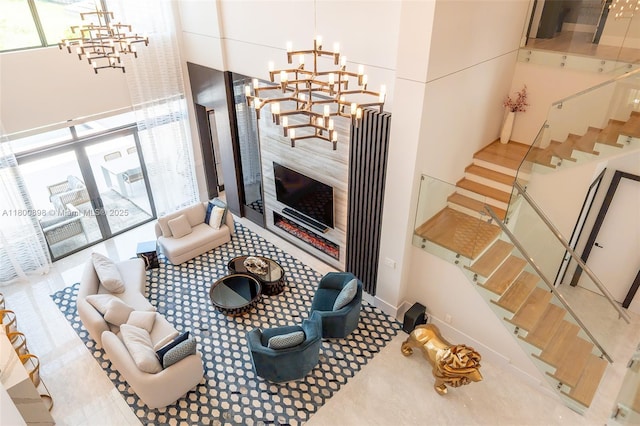 9625 Vescovato Way, Boca Raton, FL 33496 - living room with a chandelier, plenty of natural light, a high ceiling, and stairway