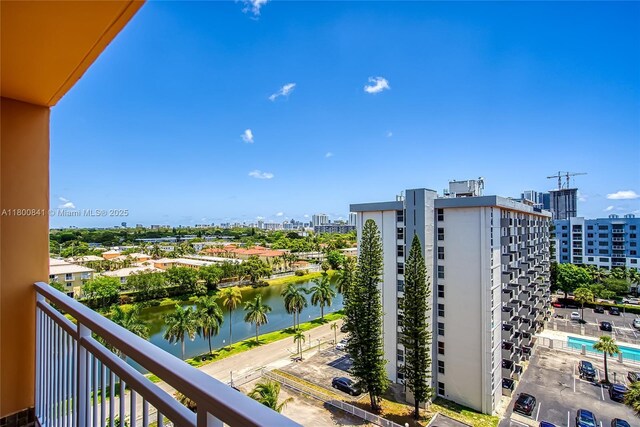 balcony with a view of city and a water view