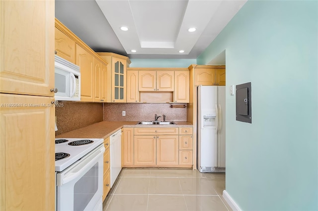 kitchen featuring white appliances, a sink, light brown cabinets, electric panel, and light tile patterned flooring