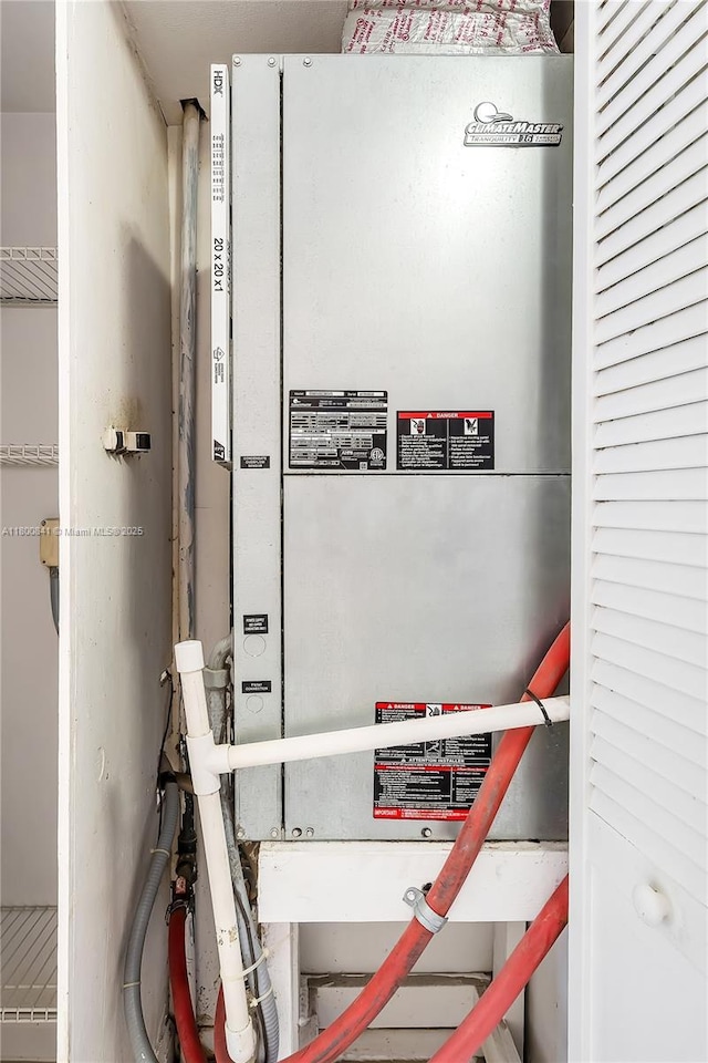 utility room featuring heating unit