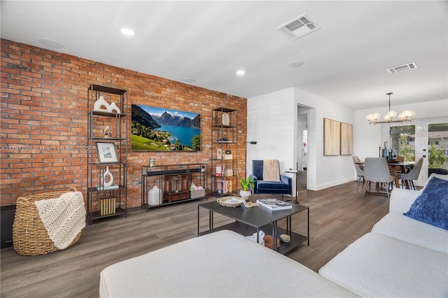 9621 SW 59th Ter, Miami, FL 33173 - living area with a chandelier, brick wall, wood finished floors, baseboards, and recessed lighting