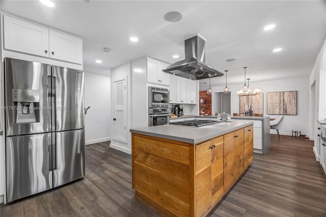 9621 SW 59th Ter, Miami, FL 33173 - kitchen featuring stainless steel appliances, island range hood, baseboards, a center island, and dark wood-type flooring