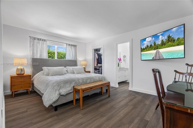 9621 SW 59th Ter, Miami, FL 33173 - bedroom featuring dark wood finished floors, baseboards, a closet, a spacious closet, and ensuite bathroom