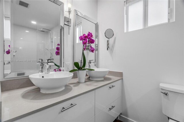 9621 SW 59th Ter, Miami, FL 33173 - bathroom featuring double vanity, a shower, and toilet