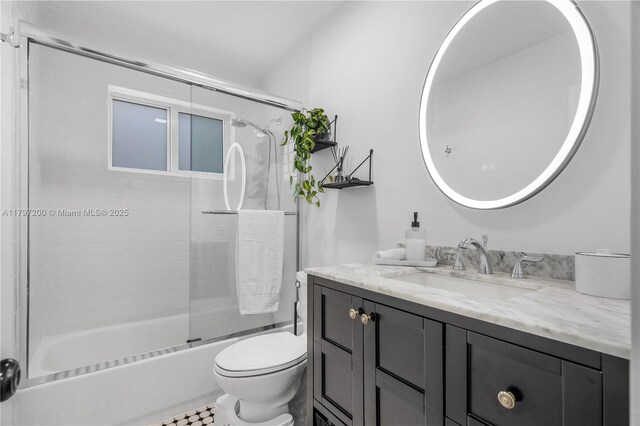 9621 SW 59th Ter, Miami, FL 33173 - full bathroom with vanity, toilet, and bath / shower combo with glass door