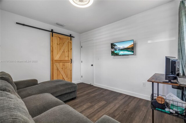 9621 SW 59th Ter, Miami, FL 33173 - living room featuring a barn door, dark wood-type flooring, and baseboards