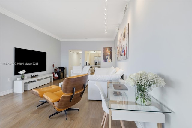 20505 E Country Club Dr Unit 143, Aventura, FL 33180 - living area with rail lighting, crown molding, wood finished floors, and baseboards