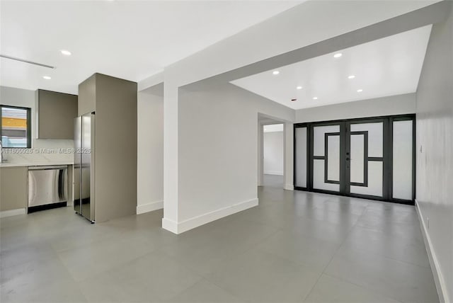 129 NE 2nd Ave, Dania Beach, FL 33004 - unfurnished room with baseboards and recessed lighting