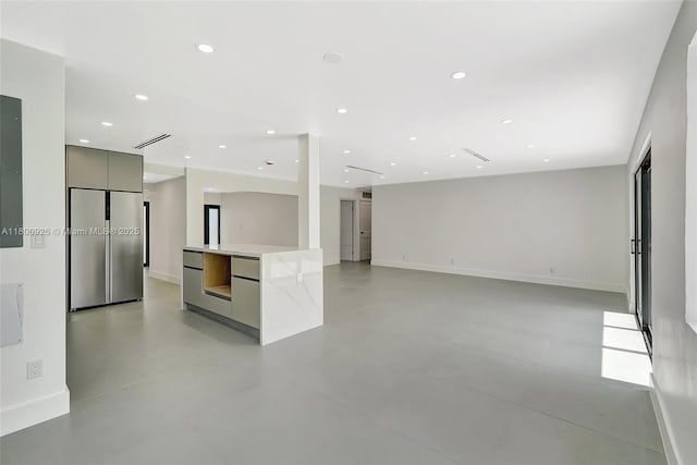 129 NE 2nd Ave, Dania Beach, FL 33004 - unfurnished living room with recessed lighting and baseboards