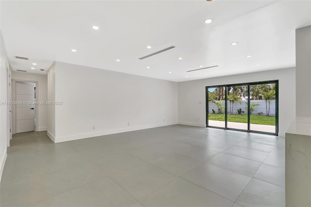 129 NE 2nd Ave, Dania Beach, FL 33004 - empty room featuring recessed lighting, baseboards, and light tile patterned floors
