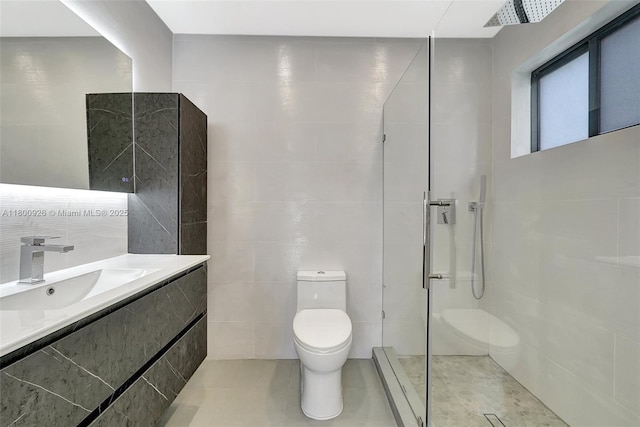 129 NE 2nd Ave, Dania Beach, FL 33004 - full bathroom featuring tile walls, toilet, a tile shower, vanity, and tile patterned floors