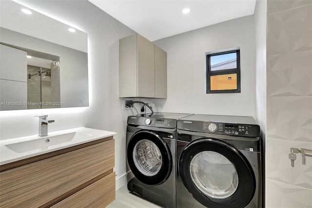 129 NE 2nd Ave, Dania Beach, FL 33004 - washroom featuring washing machine and clothes dryer and recessed lighting