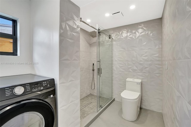129 NE 2nd Ave, Dania Beach, FL 33004 - full bath with washer / dryer, toilet, a stall shower, tile walls, and recessed lighting