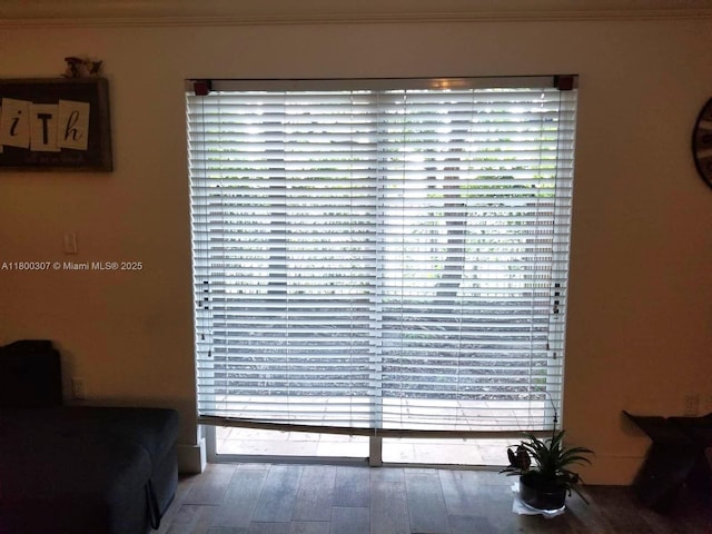 detailed view of ornamental molding and wood finished floors