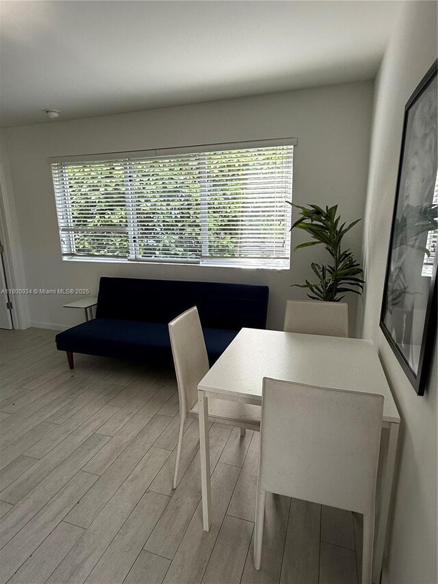 1601 Meridian Ave Unit 101, Miami Beach, FL 33139 - dining area with light wood-type flooring