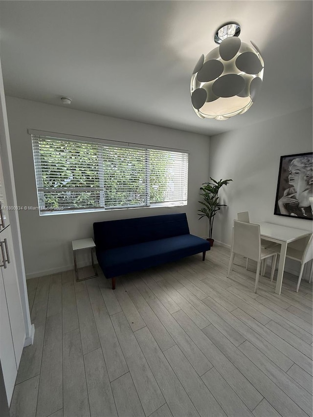 1601 Meridian Ave Unit 101, Miami Beach, FL 33139 - living room featuring wood finished floors and baseboards