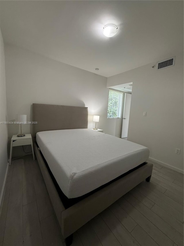 1601 Meridian Ave Unit 101, Miami Beach, FL 33139 - bedroom with wood finished floors and baseboards