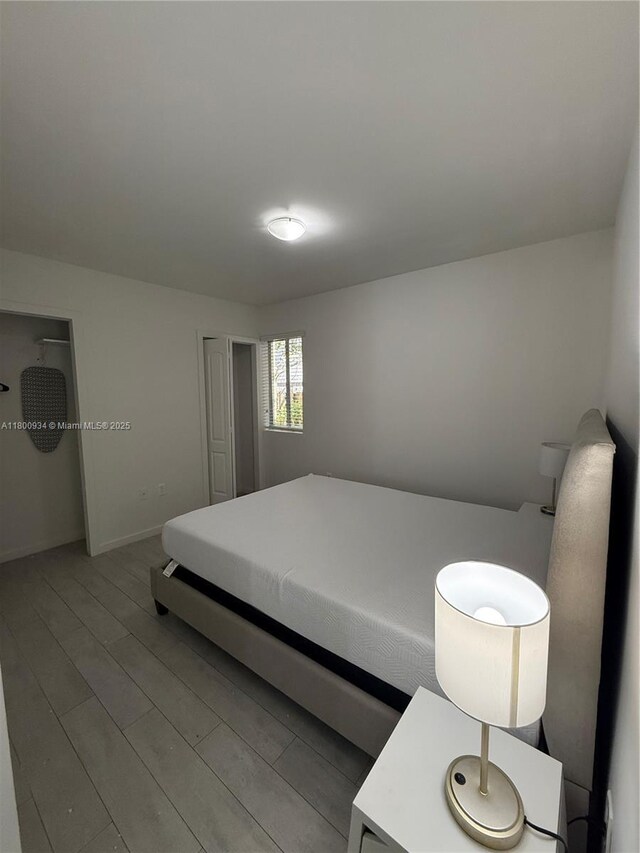 1601 Meridian Ave Unit 101, Miami Beach, FL 33139 - bedroom with wood finished floors and baseboards