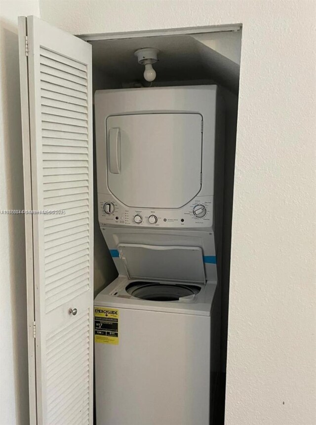 307 NW 84th St Unit 307, Miami, FL 33150 - clothes washing area with stacked washer / drying machine